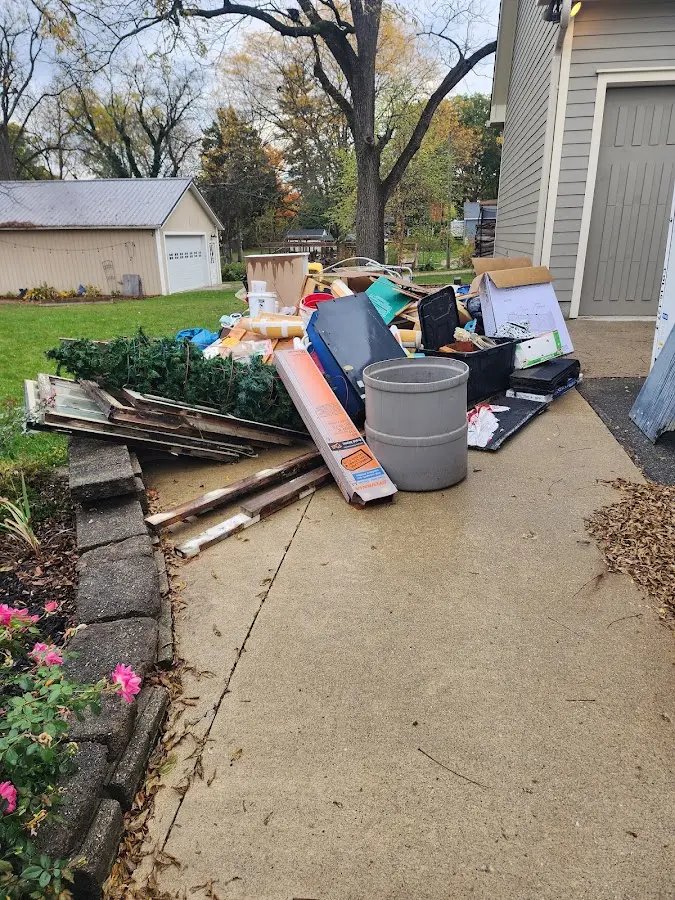 Dumpster being loaded with debris for Estate Cleanout Dumpster Rental in Union City